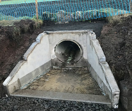bespoke-four-section-headwall-installed-with-insitu-concrete-apron-stitch-to-be-formed a bespoke 4 section headwall installed with insitu concrete apron stitch to be formed