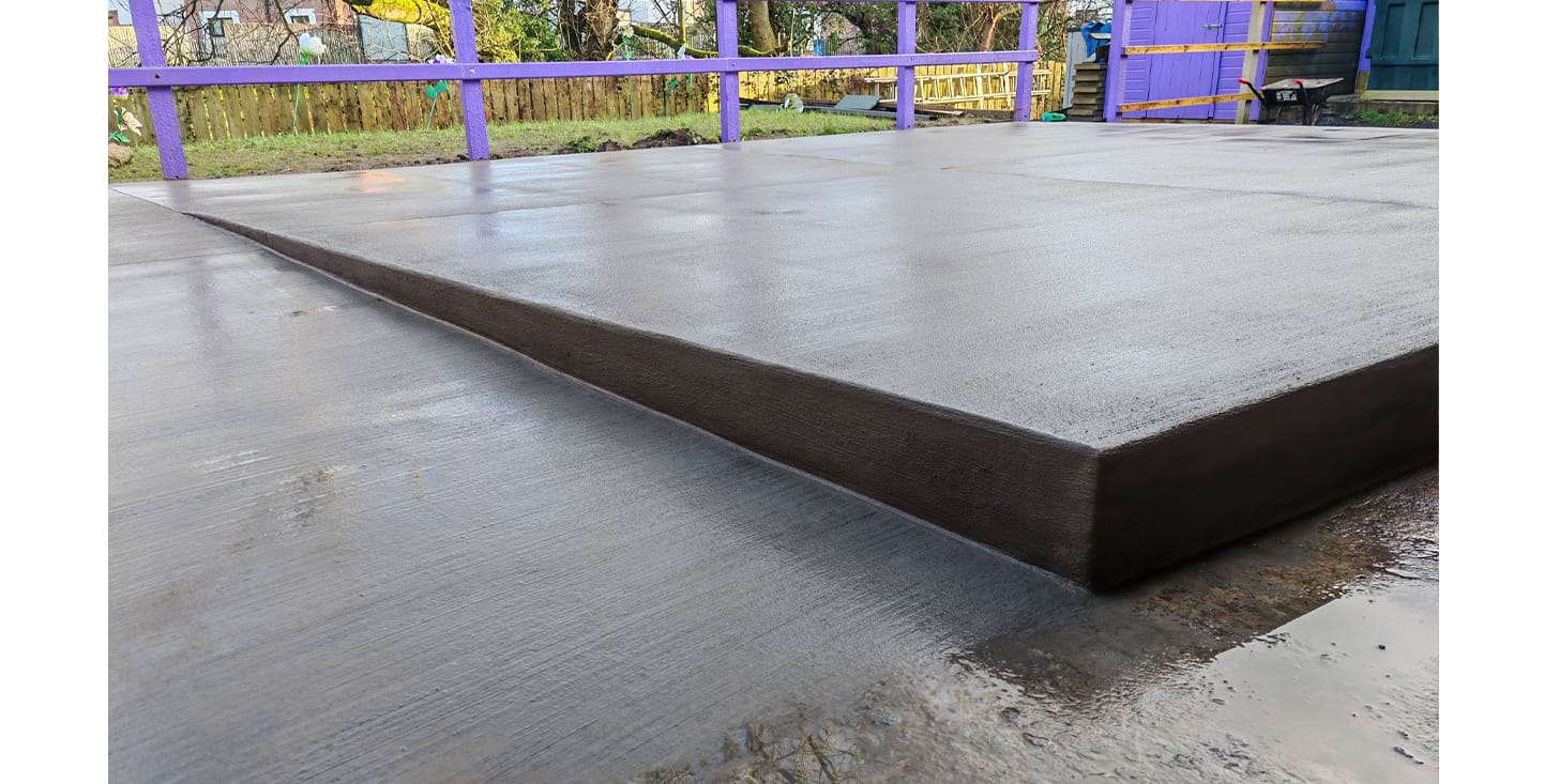 Ready mix concrete wheelchair access ramp set in backyard