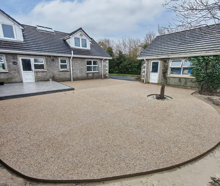 backyard-overhaul-lite-gold-concrete-exposed-aggregate-fp-mccann Lite Gold coloured exposed aggregate concrete used in a backyard space in County Antrim