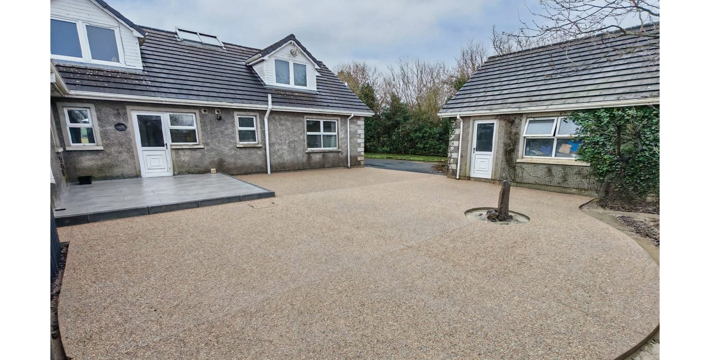 Modern outdoor space finished with exposed aggregate and stamped concrete