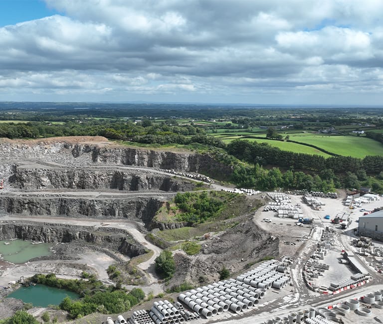 Aerial view of FP McCann Knockloughrim Quarry in Magherafelt, showing concrete and aggregate stockpiles