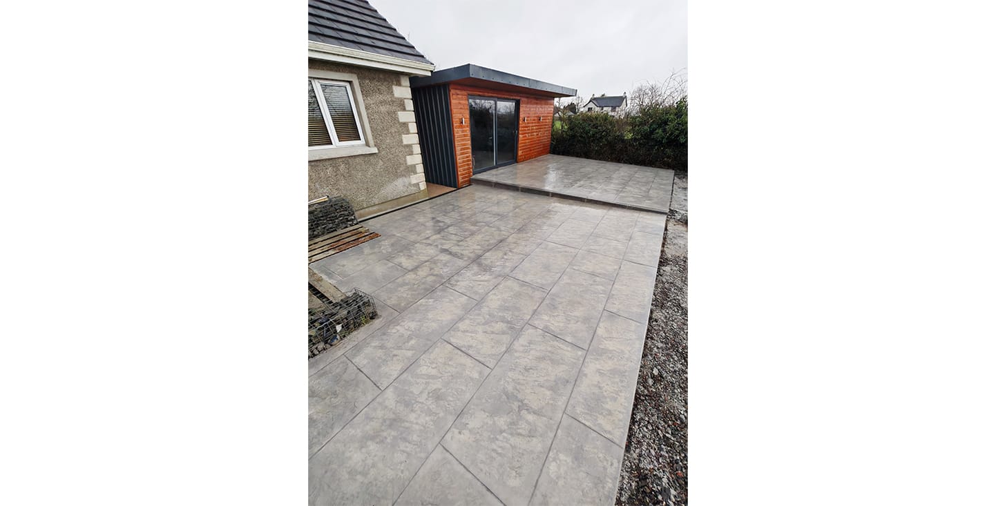 Imprinted tile-effect ready mix concrete creating a patio area at a residential home