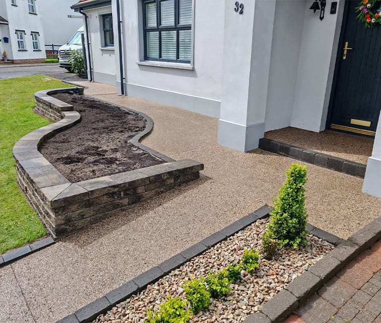 FP-Mccann-concrete-exposed-front-garden-castledawson FP McCann Concrete Exposed surfacing used to create a modern residential entrance and pathways in Castledawson.