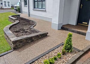 Concrete Exposed driveway entrance and pathways finished in Lite Gold aggregate at a residential property in Castledawson.