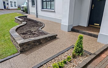 Concrete Exposed driveway entrance and pathways finished in Lite Gold aggregate at a residential property in Castledawson.